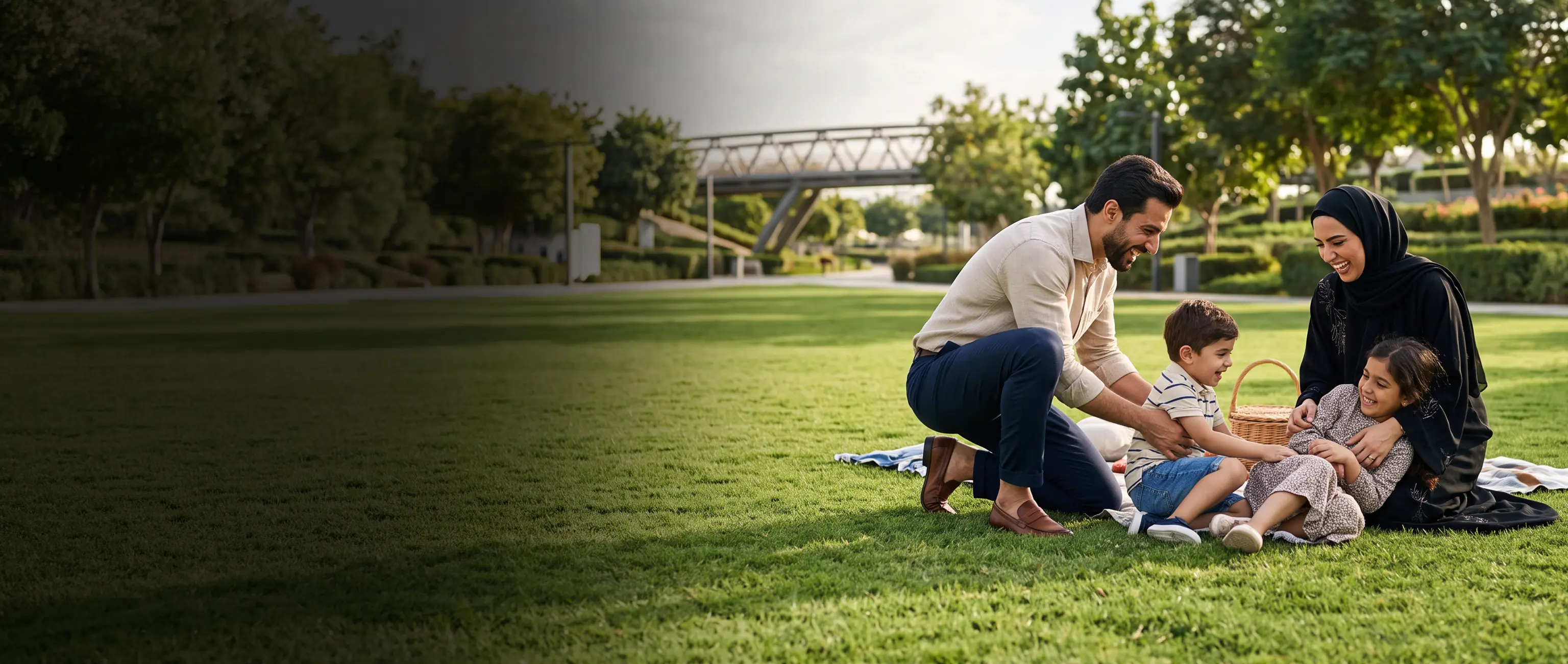 A happy family enjoying a park picnic, reflecting the joy and financial freedom when you get rewarded with National Bonds.