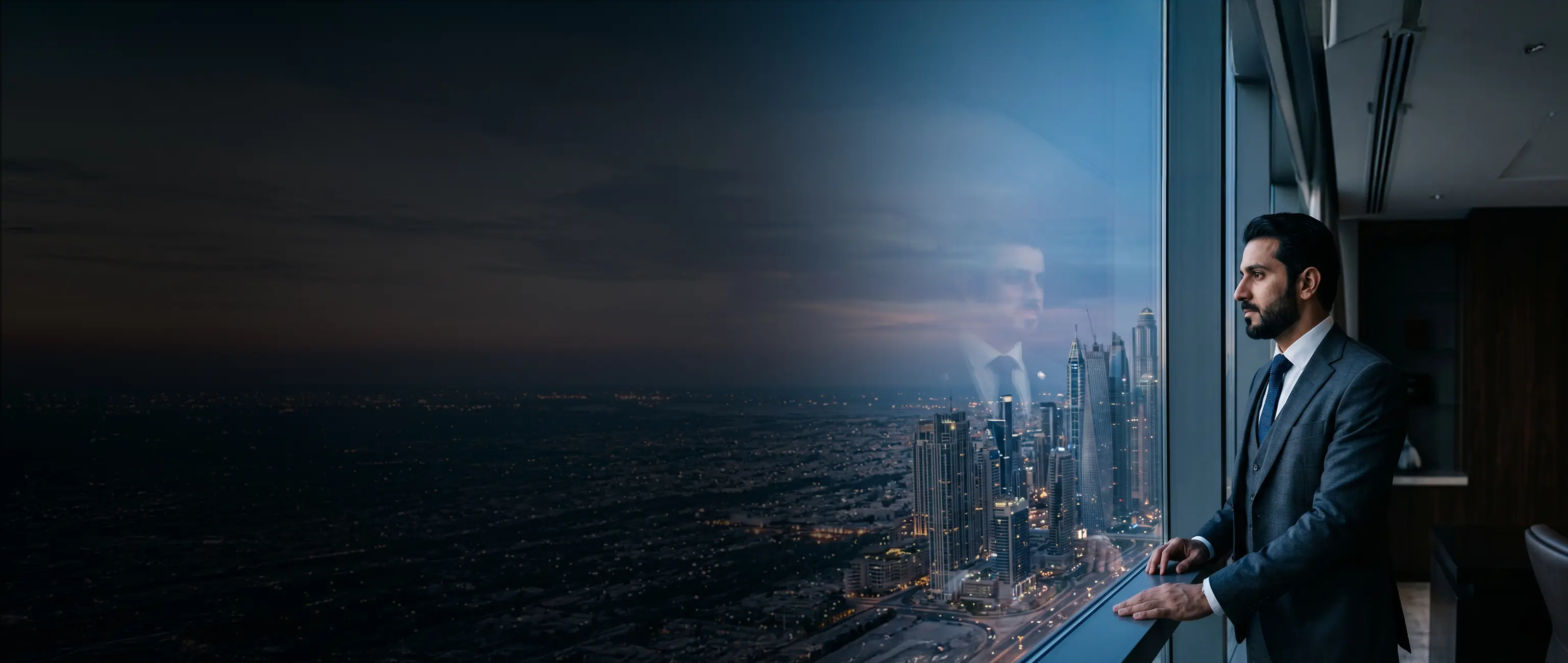 A professional businessman looking thoughtfully at the city skyline from a high-rise window, representing strategic financial vision and secure Term Plans by National Bonds.